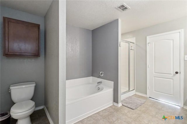 bathroom featuring separate shower and tub and toilet