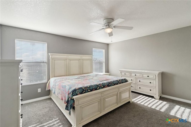 bedroom featuring ceiling fan and carpet