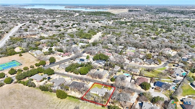 drone / aerial view featuring a residential view and a water view