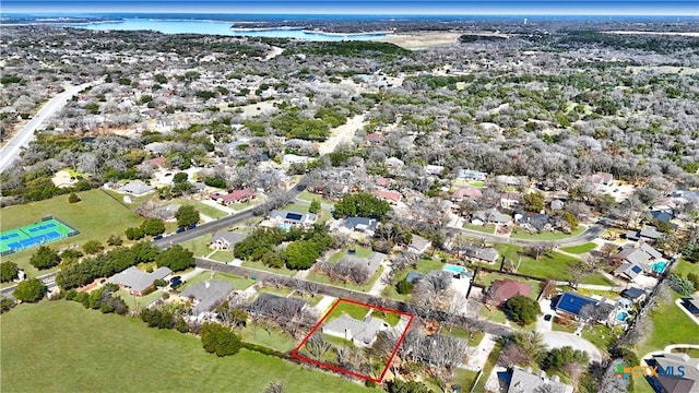 birds eye view of property with a residential view and a water view