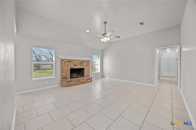 unfurnished living room with a ceiling fan, light tile patterned flooring, a fireplace, and visible vents