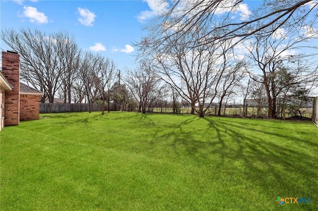 view of yard featuring fence