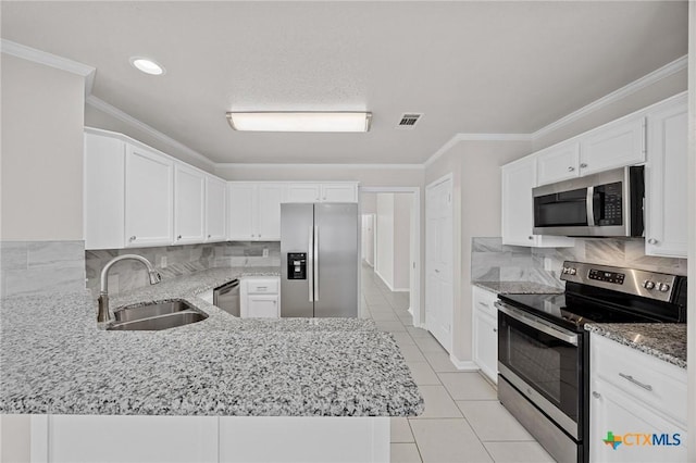 kitchen with visible vents, light stone countertops, stainless steel appliances, crown molding, and a sink