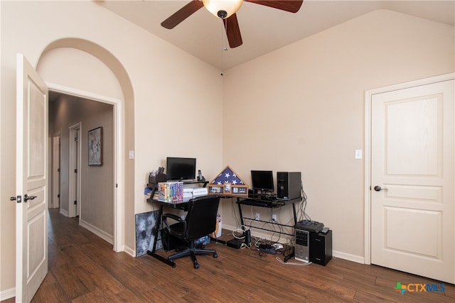 home office featuring dark hardwood / wood-style flooring, lofted ceiling, and ceiling fan