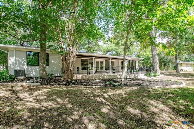 rear view of property with a porch