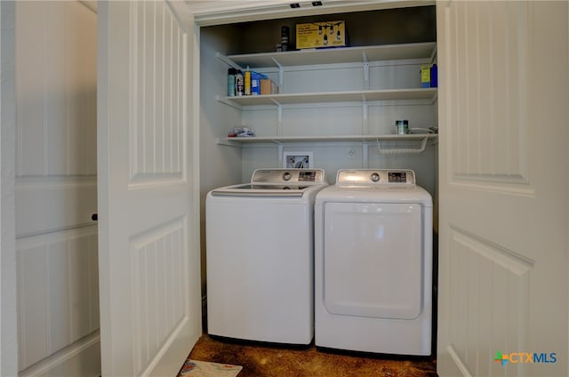 washroom with washing machine and dryer