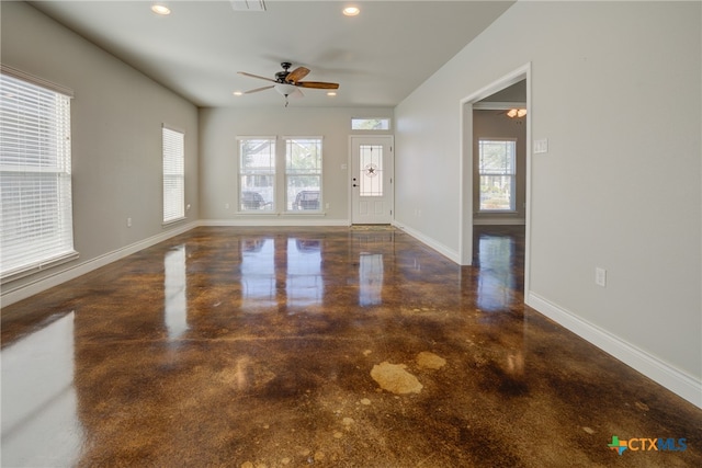 interior space with ceiling fan and plenty of natural light