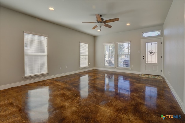 foyer entrance with ceiling fan