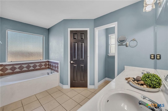 bathroom with tile patterned flooring, vanity, and a washtub