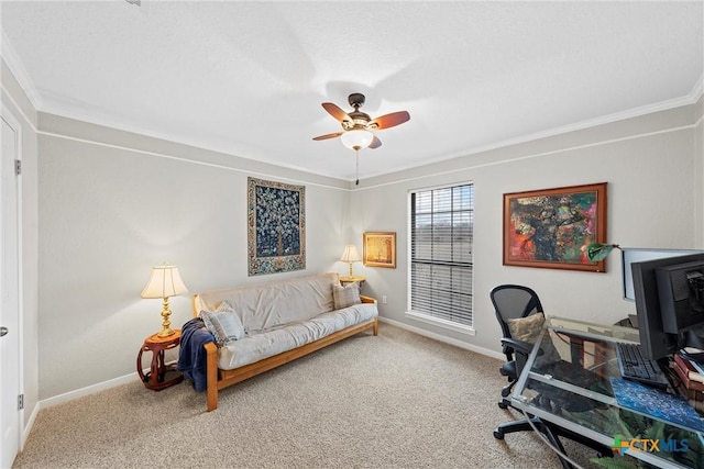 office area with ornamental molding, carpet, and ceiling fan