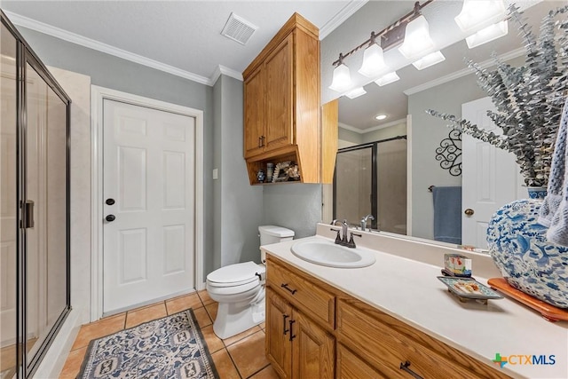 bathroom with an enclosed shower, vanity, ornamental molding, tile patterned floors, and toilet