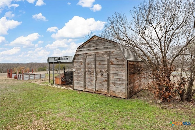 view of outdoor structure with a yard