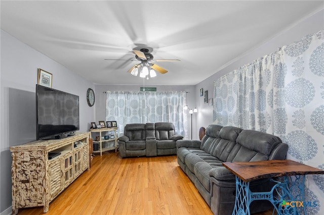 living room featuring hardwood / wood-style flooring and ceiling fan