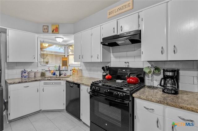 kitchen featuring white cabinetry, sink, black appliances, light tile patterned floors, and decorative backsplash