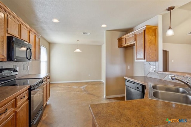 kitchen with baseboards, a sink, hanging light fixtures, black appliances, and backsplash