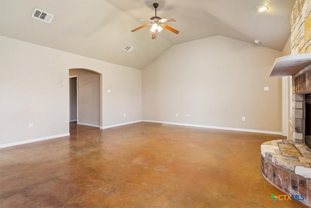 unfurnished living room featuring visible vents, arched walkways, ceiling fan, vaulted ceiling, and a large fireplace