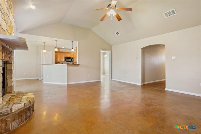 unfurnished living room featuring visible vents, arched walkways, a stone fireplace, and ceiling fan