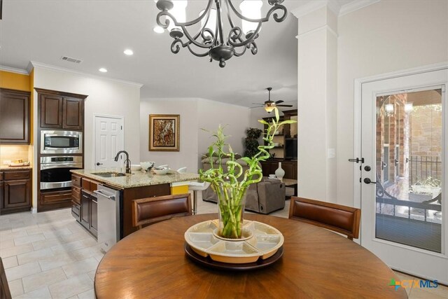 9550 Savannah Ridge Dr Unit 11, Austin, TX 78726 - dining space featuring ornamental molding, recessed lighting, a chandelier, and a ceiling fan