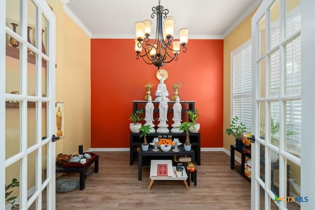 9550 Savannah Ridge Dr Unit 11, Austin, TX 78726 - entryway with a chandelier, french doors, crown molding, wood finished floors, and baseboards