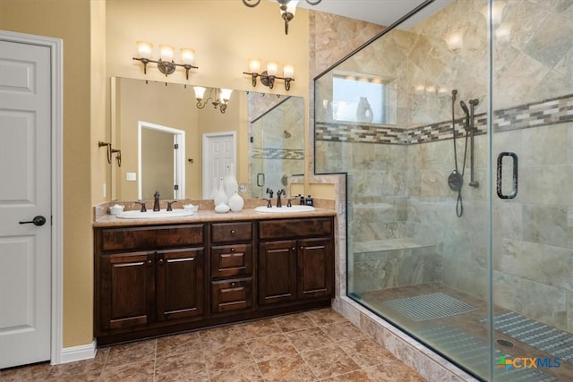 9550 Savannah Ridge Dr Unit 11, Austin, TX 78726 - bathroom featuring a shower stall, double vanity, and a chandelier