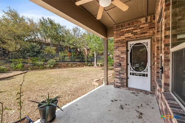 9550 Savannah Ridge Dr Unit 11, Austin, TX 78726 - entrance to property with a ceiling fan, brick siding, and a patio area