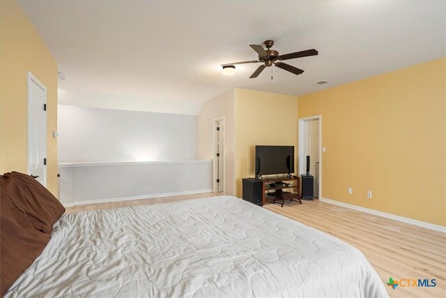 9550 Savannah Ridge Dr Unit 11, Austin, TX 78726 - bedroom with wood finished floors, baseboards, and ceiling fan