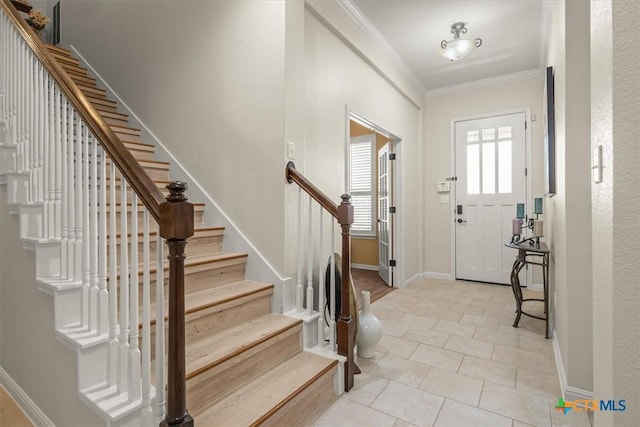 9550 Savannah Ridge Dr Unit 11, Austin, TX 78726 - foyer entrance featuring ornamental molding, light tile patterned flooring, stairs, and baseboards