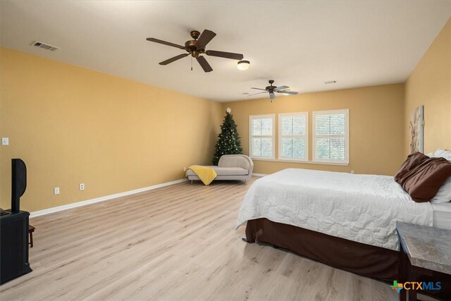 9550 Savannah Ridge Dr Unit 11, Austin, TX 78726 - bedroom featuring wood finished floors, baseboards, and a ceiling fan