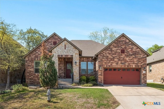 9550 Savannah Ridge Dr Unit 11, Austin, TX 78726 - view of front of house with driveway, a front yard, a garage, and brick siding