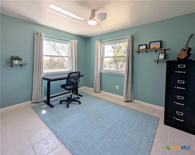 4770 Fm 2808, Kempner, TX 76539 - office space with light tile patterned flooring, a textured ceiling, a ceiling fan, and baseboards