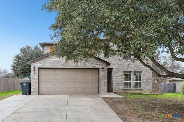 view of front facade featuring concrete driveway, brick siding, fence, and a garage