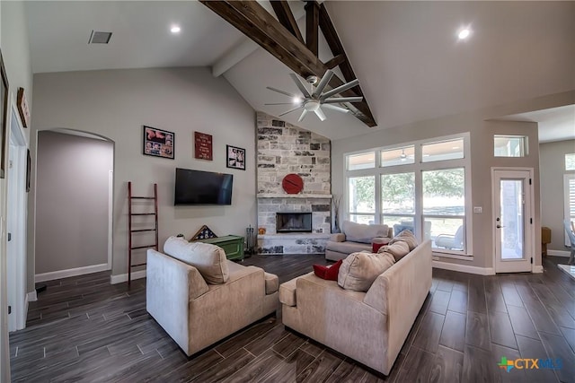 living room with beamed ceiling, high vaulted ceiling, a fireplace, and ceiling fan