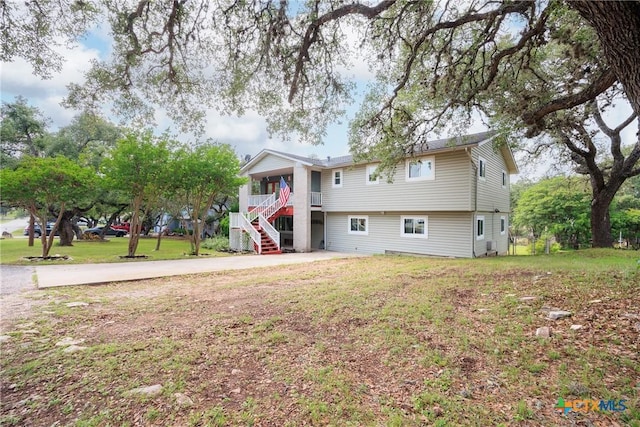 1215 Amanda, Canyon Lake, TX 78133 - view of front of house featuring stairs and a front lawn