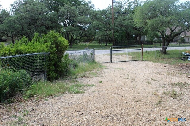 1215 Amanda, Canyon Lake, TX 78133 - view of yard featuring a gate