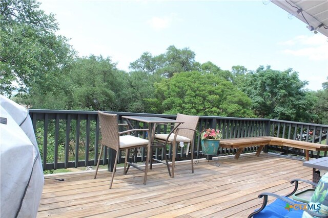 1215 Amanda, Canyon Lake, TX 78133 - wooden deck featuring view of wooded area