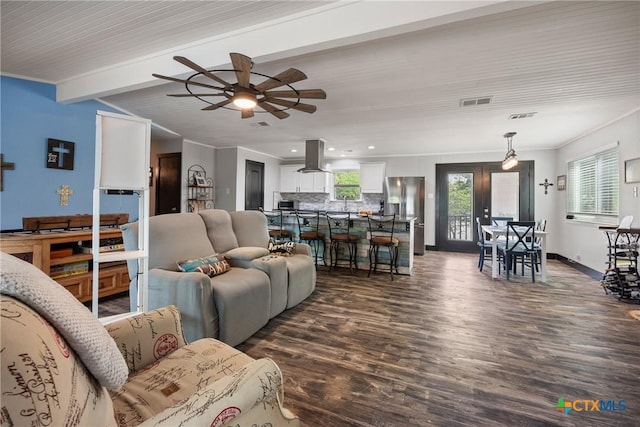 1215 Amanda, Canyon Lake, TX 78133 - living room featuring dark wood-style floors, a ceiling fan, beam ceiling, ornamental molding, and recessed lighting