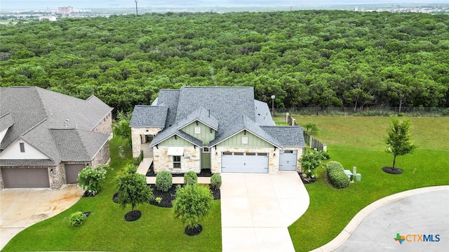 bird's eye view featuring a forest view