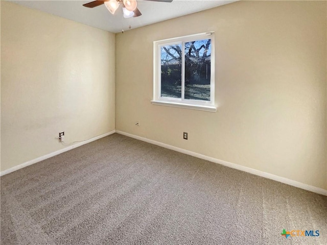 spare room with carpet flooring and ceiling fan