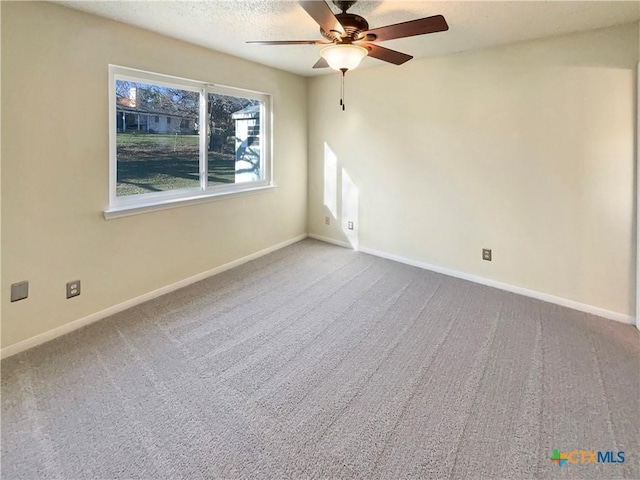 unfurnished room featuring carpet floors and ceiling fan