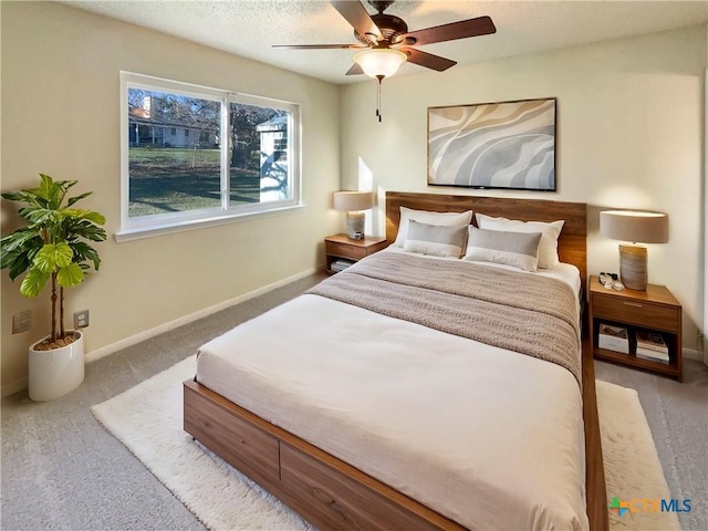 bedroom with ceiling fan and light colored carpet