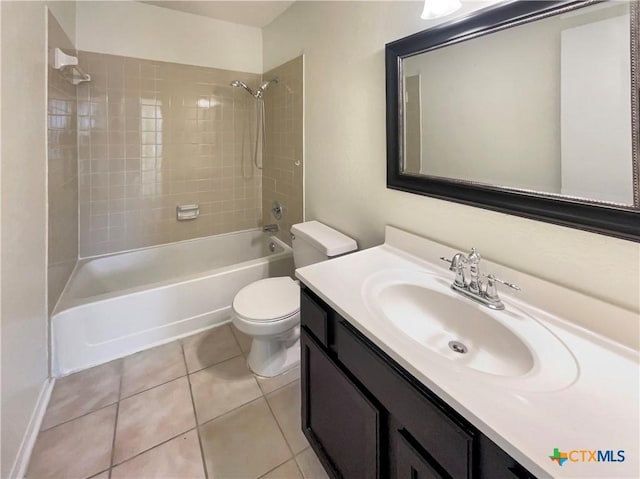 full bathroom with vanity, toilet, tile patterned flooring, and tiled shower / bath