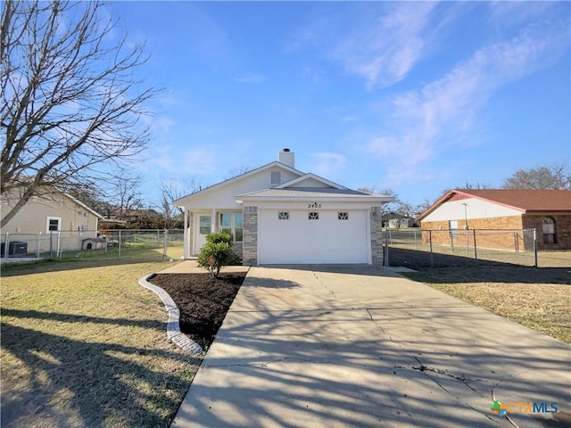 view of front of home with a garage and a front lawn