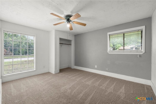 8704 Trailridge Dr, Temple, TX 76502 - unfurnished bedroom with multiple windows, carpet, and a closet