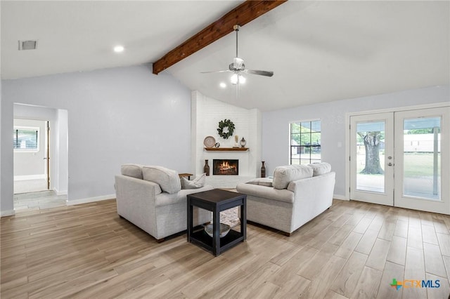 8704 Trailridge Dr, Temple, TX 76502 - living room with plenty of natural light, light wood-type flooring, ceiling fan, and a brick fireplace