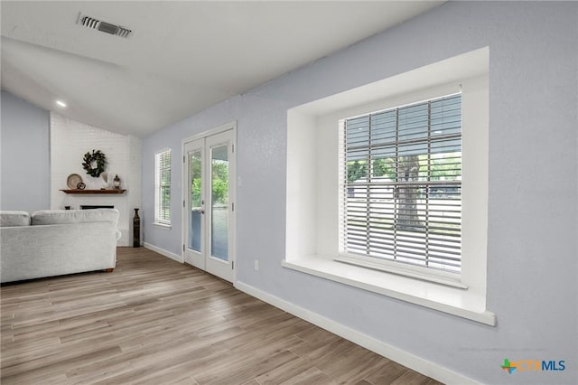 8704 Trailridge Dr, Temple, TX 76502 - unfurnished living room featuring vaulted ceiling and wood finished floors