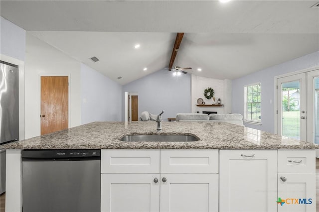 8704 Trailridge Dr, Temple, TX 76502 - kitchen featuring stainless steel appliances, ceiling fan, open floor plan, white cabinetry, and light stone countertops