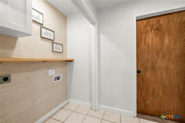 8704 Trailridge Dr, Temple, TX 76502 - laundry area featuring electric dryer hookup, light tile patterned floors, and hookup for a washing machine
