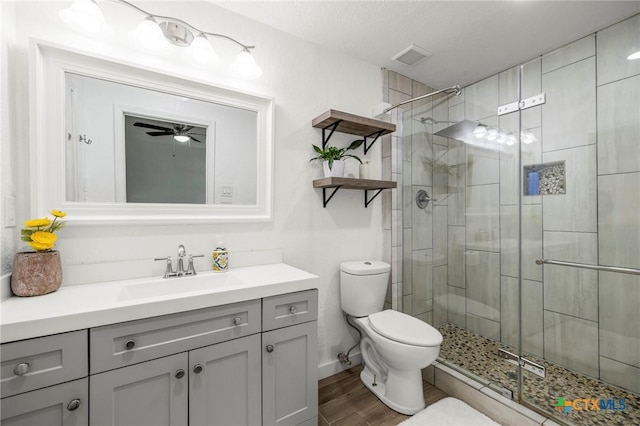 8704 Trailridge Dr, Temple, TX 76502 - bathroom with vanity, a stall shower, wood finished floors, and ceiling fan