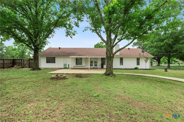 8704 Trailridge Dr, Temple, TX 76502 - back of house with a patio, a fenced backyard, an outdoor fire pit, and french doors
