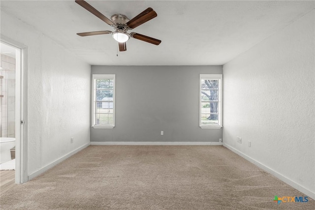 8704 Trailridge Dr, Temple, TX 76502 - empty room featuring a ceiling fan, carpet floors, and a textured wall